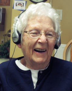 elderly woman listen to music and smiling