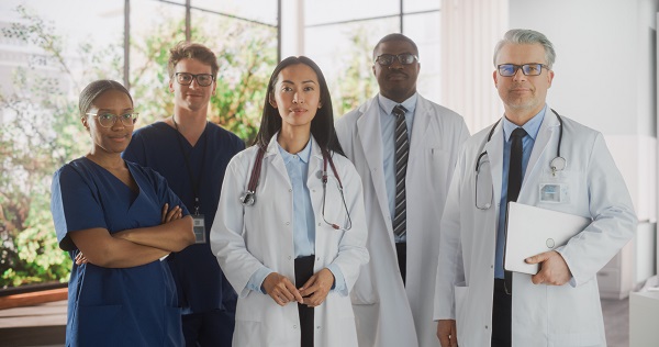 Team Portrait, Female and Male Diverse Medical Healthcare Professionals Standing in Modern Hospital Office